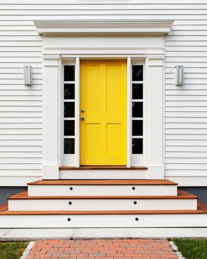 Yellow Entry door on white exterior