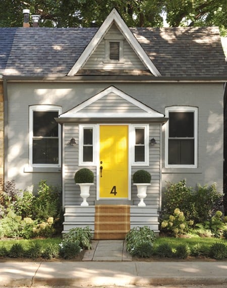 Yellow enrty door with grey exterior