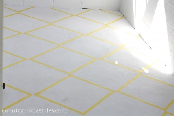tape design to paint a concrete mudroom floor