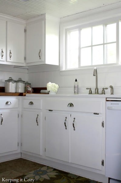 white kitchen cabinets with stainless steel pulls. best kitchen remodel ideas -- white painted cabinets with reclaimed wood countertops, Keeping It Cozy on Remodelaholic