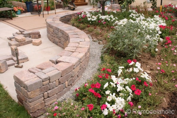 how to build a curved retaining wall using Rumblestone blocks, from Remodelaholic