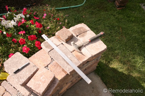 How to add a top to a DIY retaining wall, by Remodelaholic