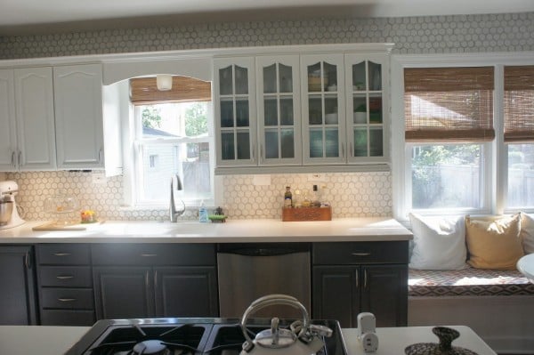 kitchen makeover with hexagon tile backsplash and painted gray and white cabinets, LoveLee Homemaker featured on Remodelaholic