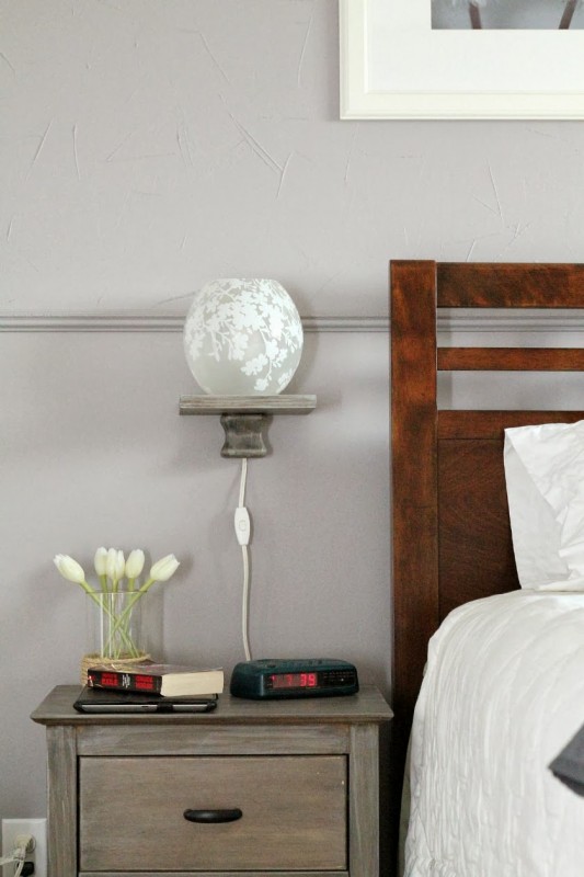 bedside storage solution: modern floating shelf with lamp, Turtles and Tails featured on Remodelaholic.com