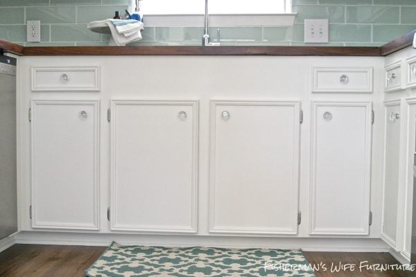 undermount sink front with white cabinets and glass knobs, Fisherman's Wife Furniture featured on Remodelaholic.com