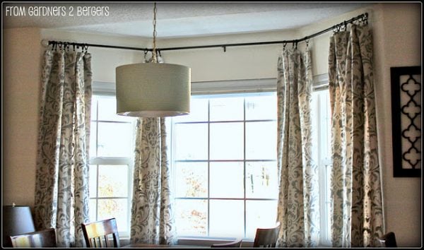 damask stenciled curtains - featured on Remodelaholic