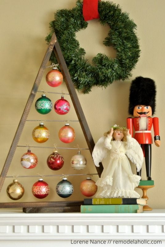 Knockoff the Crate and Barrel wood ornament display tree for a fraction of the price using these free plans! Use it as an advent calendar or as a replacement for a traditional tree. Perfect for vintage and special ornaments. #remodelaholic #christmasdiy #diyChristmastree